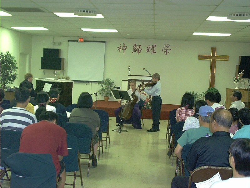 Serving the Lord with daughter Stacey and son Austin playing cello and violin during the Christmas program in PBCCC